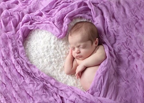 How soon should I schedule a newborn photography session?