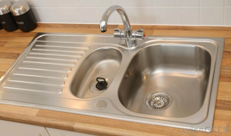 Why is stainless steel used for kitchen sinks and cutlery
