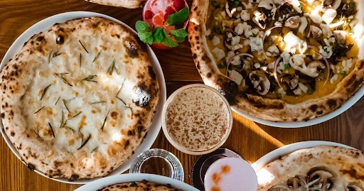 Why Woodfire Pizza Is Taking Over Menus at Every Top Italian Pizza Restaurant