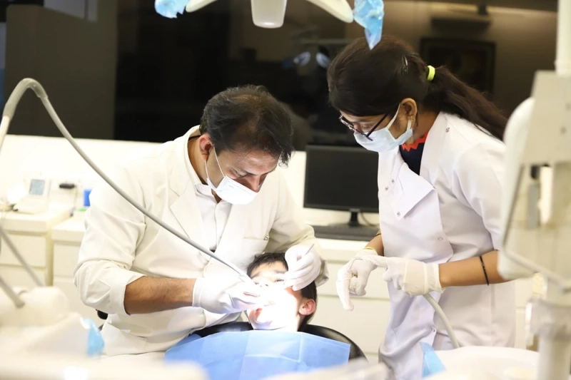 What Cosmetic Dental Solutions Are Available at The Dental Roots for Stained, Chipped, or Uneven Teeth?