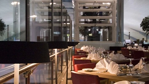 What are the benefits of staying in an airport hotel during a trip?