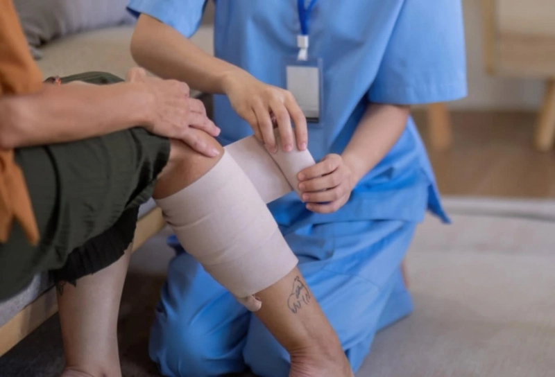 Receiving Specialized Treatment from a Wound Doctor During a Home Visit in Troy