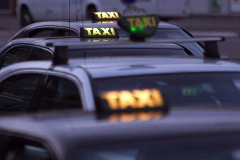 How can I check if a taxi driver has been reported for violations in the past?