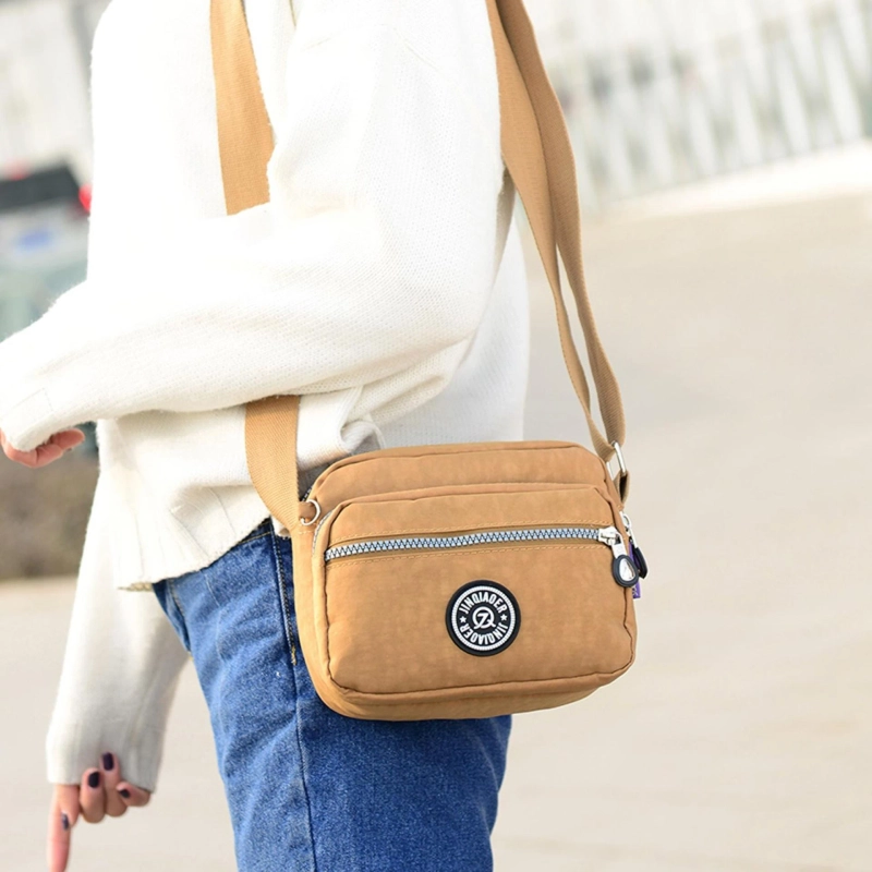 How do I clean and maintain a travel shoulder bag?