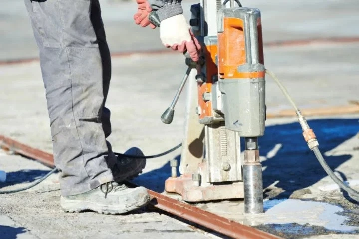 What is the scope of concrete coring in construction?