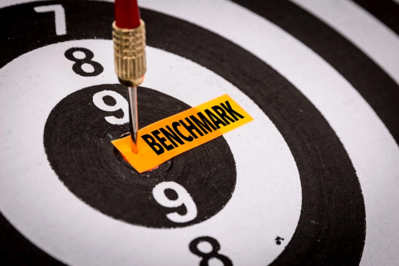 How does energy benchmarking contribute to energy efficiency improvements?